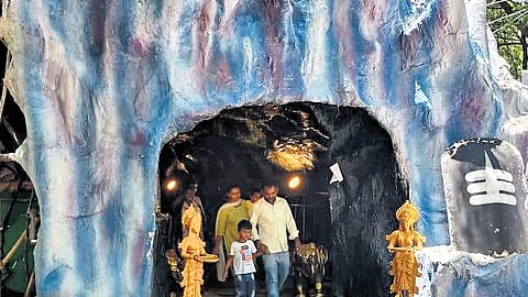 Devotees visit a cave-themed pandal during the ongoing Ganesh Chaturthi at Vidyanagar in Karimnagar on Saturday