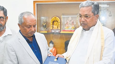 Justice H N Nagamohan Das hands over the inquiry report to Chief Minister Siddaramaiah on Saturday 