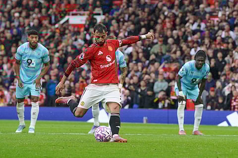 Manchester United's Bruno Fernandes shoots a penalty kick to score during the English Premier League soccer match between Manchester United and Burnley at Old Trafford stadium in Manchester, England, Saturday, Aug. 30, 2025.