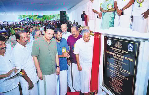 CM Pinarayi Vijayan unveils the plaque to mark the foundation stone laying for the tunnel road project in Kozhikode on Sunday