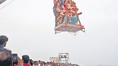 Idols of Lord Ganesha being immersed into the sea as part of Vinayagar Chaturthi festivities at Pattinapakkam on Sunday.