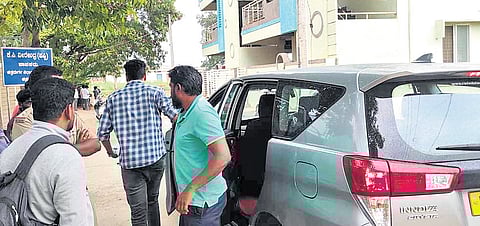 Directorate of Enforcement officials outside the residence of Chitradurga MLA 
KC Veerendra at Challakere, Chitradurga district, on Tuesday.