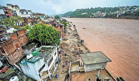 The Tawi River flowing in spate near the Gujjar Nagar area in Jammu Tuesday | PTI