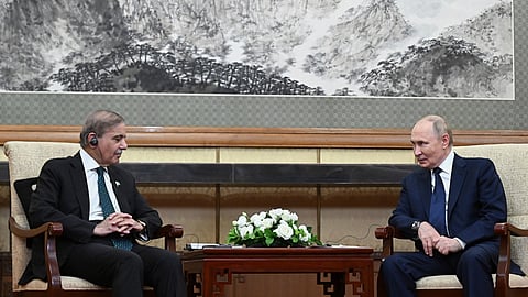 Russian President Vladimir Putin, right, and Pakistani Prime Minister Shehbaz Sharif, left, talk to each other during their meeting at the Diaoyutai State Guesthouse in Beijing, China, Tuesday, Sept. 2, 2025.