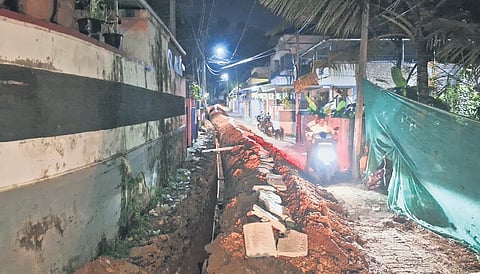 The narrow space left on Vattiyoorkavu road in Thiruvananthapuram after KSEB dug it up for underground cable installation on Tuesday night. 