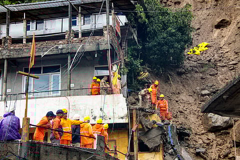 NDRF personnel during a search and rescue operation after two houses collapsed following a landslide due to heavy rainfall, at Akhada Bazaar area, in Kullu district, Himachal Pradesh, Saturday, Sept. 3, 2025.