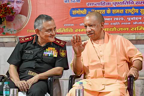 Chief of Defence Staff General Anil Chauhan, left, and Uttar Pradesh Chief Minister Yogi Adityanath during Shrimad Bhagwat Katha seminar and tribute meeting of late Mahant Digvijaynath and the 11th death anniversary of Mahant Avaidyanath, at Gorakhnath Temple.