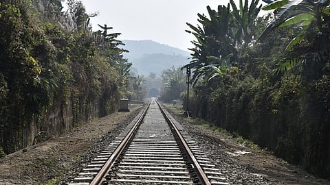 Track laid in the middle of forest and hills.