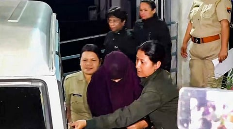 Police escort Sonam Raghuvanshi, accused in the alleged murder of her husband Raja Raghuvanshi during their honeymoon in Meghalaya, after her medical check-up at Ganesh Das Hospital, in Shillong, Wednesday, June 11, 2025.