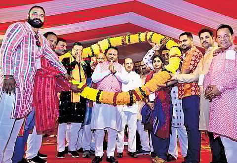 CM Mohan Majhi and other leaders being greeted at the event in Sambalpur