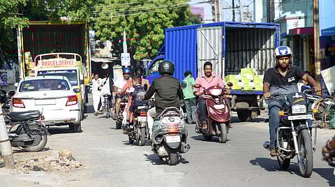 Motorists trying to weave their way through Othakadai, where four-wheelers and heavy trucks are parked haphazardly. 
