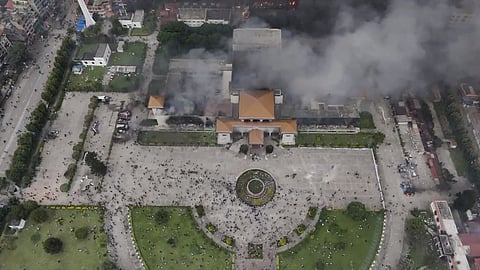 Smoke billows out after Nepal's Parliament building was set on fire by agitators
