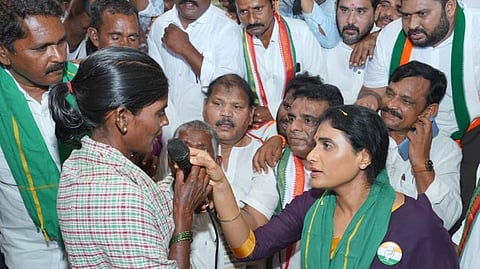 APCC chief YS Sharmila interacting with onion farmers at Kurnool agricultural market yard on Monday.