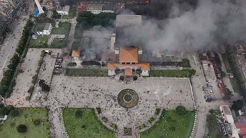 Smoke billows out after Nepal's Parliament building was set on fire by agitators amid massive anti-government protests, in Kathmandu on Tuesday.