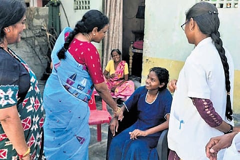 Health staff conduct a door-to-door survey in Turakapalem village.