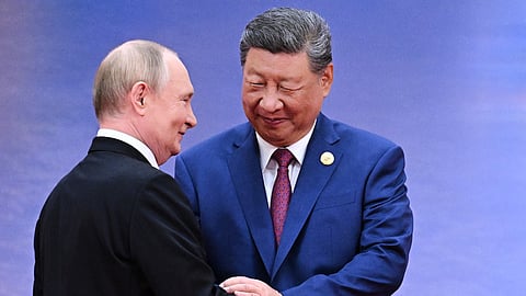 Russian President Vladimir Putin, left, and Chinese President Xi Jinping greet each other in Tianjin, China, on Aug. 31, 2025.