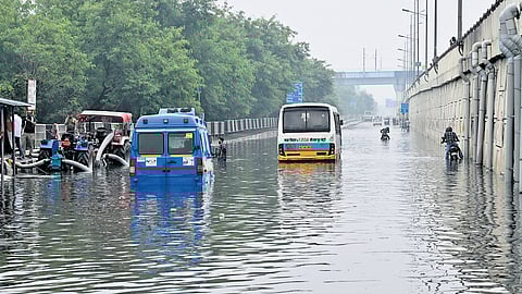 Vehicles stuck on a waterlogged road after heavy rainfall, at NH24 Patparganj area in New Delhi on Friday, Aug. 29, 2025.