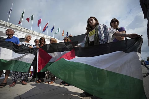 Pro Palestine demonstrators hold a press conference in front of the red carpet during the Venice Film Festival.