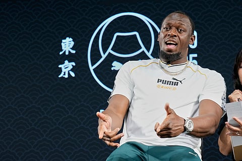 Former sprinter, Jamaica's Usain Bolt gestures during a press conference ahead of the World Athletics Championships in Tokyo, Japan, Thursday, Sept. 11, 2025.