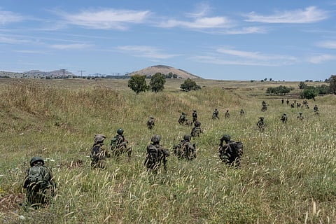 Israeli combat reservists take position during training in the Israeli-controlled Golan Heights.