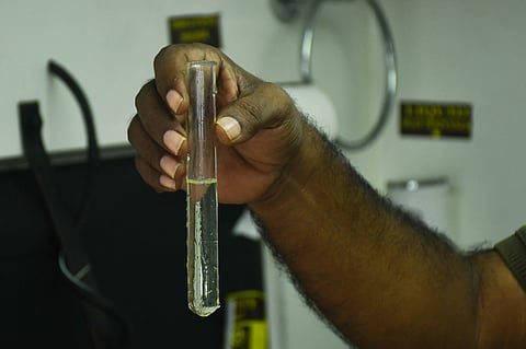 Food safety officials test water samples at the medical camp setup in RR Pet area where diarrhoea broke out in Vijayawada, on Friday.