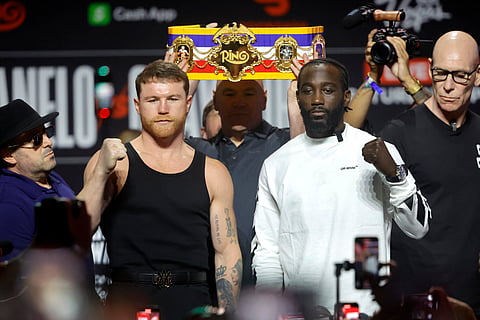 Undisputed super middleweight champion Canelo Alvarez (L) poses with Terence Crawford during a news conference at T-Mobile Arena on September 11, 2025 in Las Vegas, Nevada.