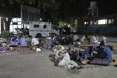 Afghans affected by a powerful earthquake that struck eastern Afghanistan on Sunday rest outside Nangarhar Regional Hospital in Jalalabad, Afghanistan, Wednesday, Sept 3, 2025.