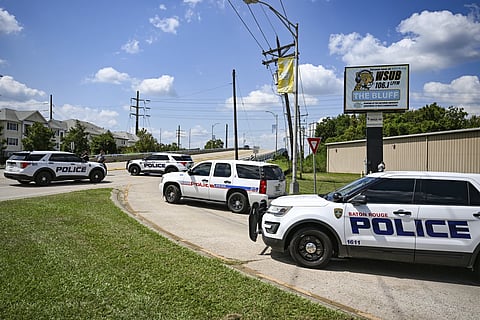 Baton Rouge Police block the entrance of Southern University's campus at the corner of Harding Boulevard and Scenic Highway, Thursday, Sept 11, 2025, in Baton Rouge, La., after a threat led administrators to announce a lockdown.