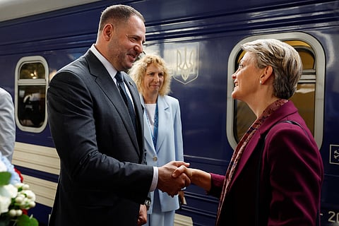 Head of the Office of the President of Ukraine Andriy Yermak, left, shakes hands with British Foreign Secretary Yvette Cooper upon her arrival at a railway station, amid Russia's attack on Ukraine, in Kyiv, Ukraine, Friday Sept. 12, 2025.