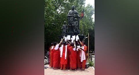 Sanitary workers protesting in front of the Rani Meyiyammai statue on the  Poonamallee high road in Egmore on Friday 