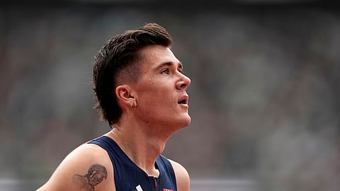 Norway's Jakob Ingebrigtsen reacts after finishing a men's 1,500 meters heat at the World Athletics Championships in Tokyo, Sunday, Sept. 14, 2025.
