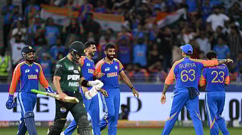 India's players celebrate after the dismissal of Pakistan's Sahibzada Farhan during the Asia Cup 2025 Twenty20 international cricket match between India and Pakistan at the Dubai International Stadium in Dubai on September 14, 2025. 