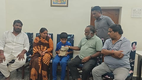 TPCC Working President T Jayaprakash Reddy providing financial assistance of Rs. 7.5 lakh to Vikas from Nizamabad district in Sangareddy on Saturday