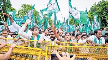 BJD workers protest in front of the Raj Bhavan, in Bhubaneswar on Monday