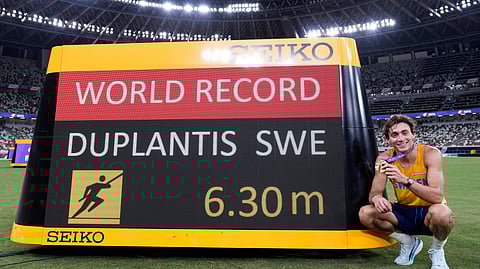 Sweden's Armand Duplantis poses after setting a new men's pole vault world record of 6.30 meters at the World Athletics Championships in Tokyo, Monday, Sept. 15, 2025.