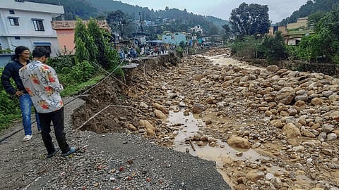At least five people were killed and over 20 went missing after a cloudburst late Monday night triggered torrential rain and widespread destruction in Dehradun.