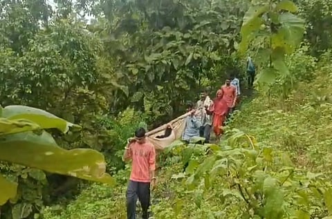 The 35-year-old woman being carried in a cloth sling to a hospital.
