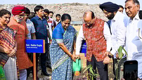 In this photo from June 6, 2025, Delhi Lieutenant Governor VK Saxena and Chief Minister Rekha Gupta participate in a 'Bamboo Tree Plantation' program, at the Okhla Landfill site in New Delhi.