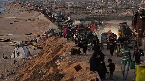 Displaced Palestinians flee northern Gaza along the coastal road toward the south, as Israel announced an expanded operation in Gaza City, Tuesday, Sept. 16, 2025.