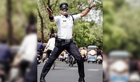 Ranjeet Singh is known for his unique moonwalk dancing moves while managing road traffic in Indore.