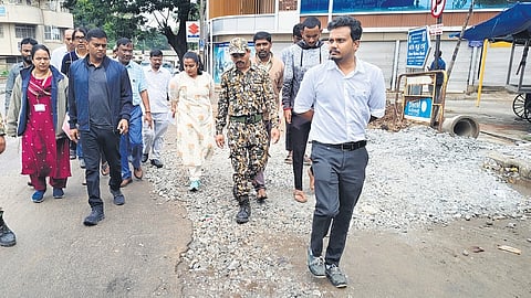 Bengaluru Central City Corporation Commissioner Rajendra Cholan (in navy blue jacket) and other GBA officials inspect road works in Bengaluru.