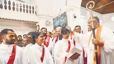 Bishop Dr Royce Manoj Victor of the Malabar diocese blesses Dr Saju Mary Abraham and Nimshi David, the first women ordained as deacons in the diocese, at a ceremony at the CSI Cathedral, Mananchira, Kozhikode 