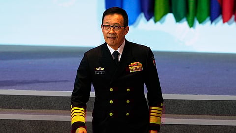 Chinese Defense Minister Dong Jun walks down the stage after speaking at China's annual security and defense dialogue, the Xiangshan Forum, in Beijing, China, Thursday, Sept. 18, 2025.