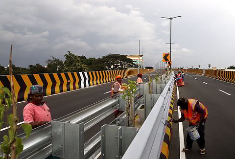 Workers engaged in painting the dividers of the Avinashi Road elevated flyover in Coimbatore.