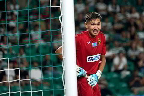 Kairat's 18-year-old goalkeeper Sherhan Kalmurza looks on during the Champions League opening phase soccer match between Sporting CP and Kairat Almaty at the Alvalade stadium in Lisbon, Thursday, Sept. 18, 2025. 