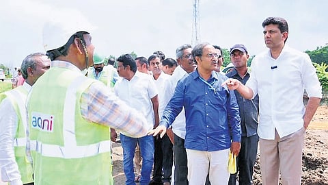 Union Minister Pemmasani Chandrasekhar, along with NHAI officials, inspecting the West Bypass road works near Guntur on Thursday 