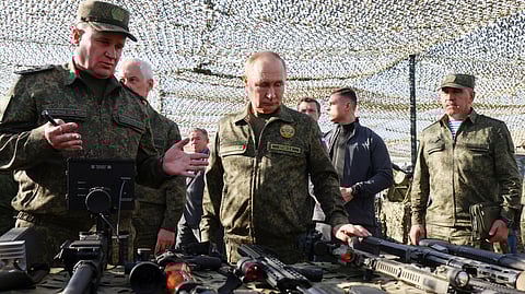 Russian President Vladimir Putin inspects Russian weapons and equipment during his visit to the Russian-Belarusian joint military drills "Zapad 2025" (West 2025) at the Mulino training ground in the Nizhny Novgorod region, Russia, Tuesday, Sept. 16, 2025.