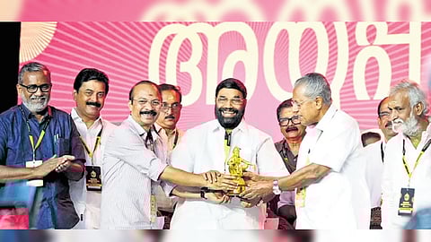 Travancore Devaswom Board president P S Prasanth handing over an Ayyappa Idol to Chief Minister Pinarayi Vijayan during the inauguration of the Global Ayyappa Sangamam at Pampa on Saturday.