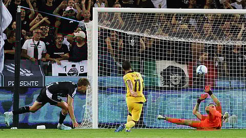 AC Milan's Christian Pulisic, center, scores during the Serie A soccer match between Udinese and AC Milan at the Bluenergy Stadium in Udine, Italy, Saturday, Sept. 20, 2025.