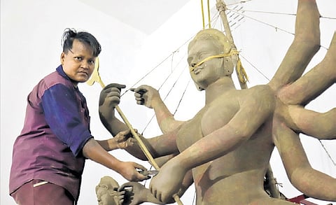 This year, Soma is making idols at four community puja pandals.